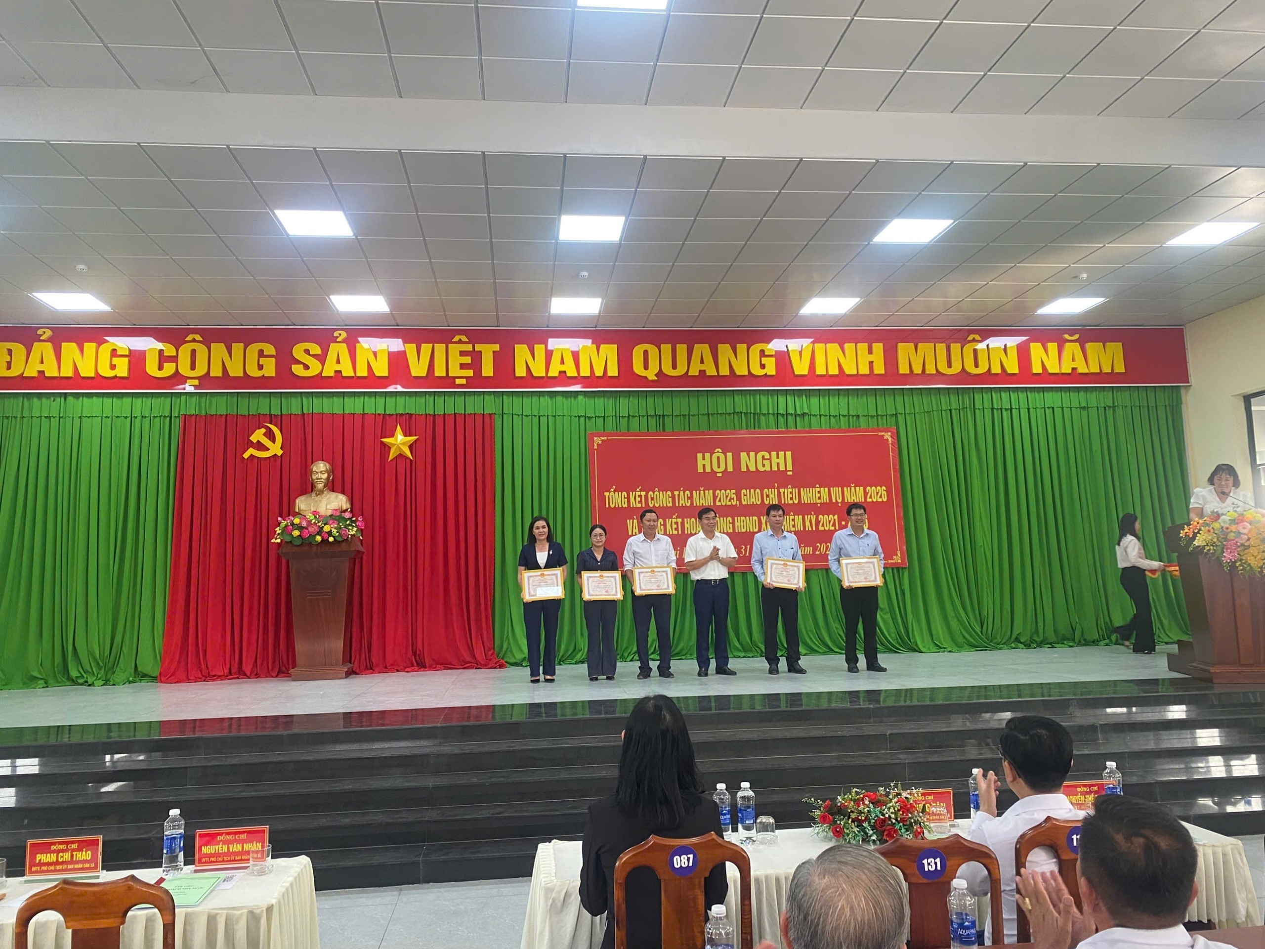 'A group of people on a stage
Description automatically generated'