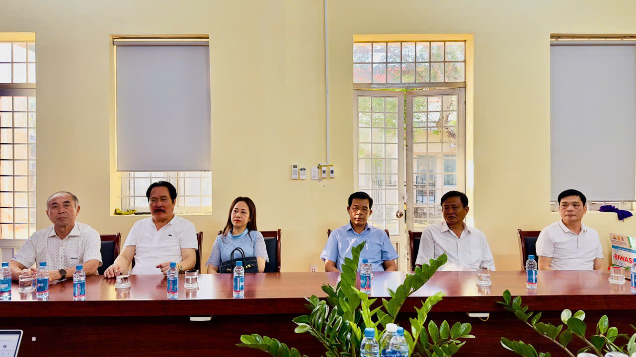 ''A group of people sitting at a table
AI-generated content may be incorrect.''