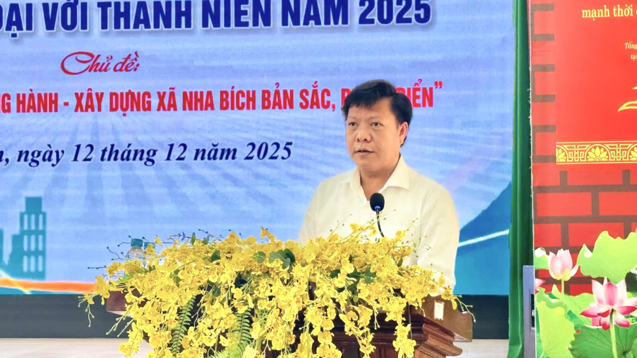 '''A person standing at a podium with a microphone
AI-generated content may be incorrect.'''