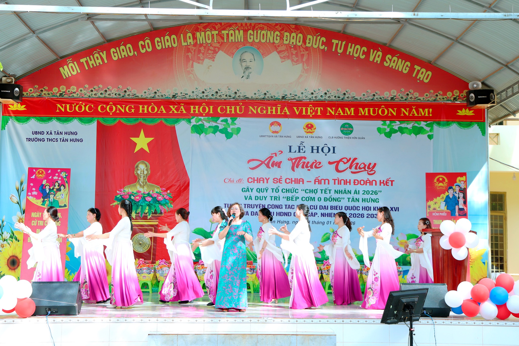 '''A group of women performing on stage
Description automatically generated'''