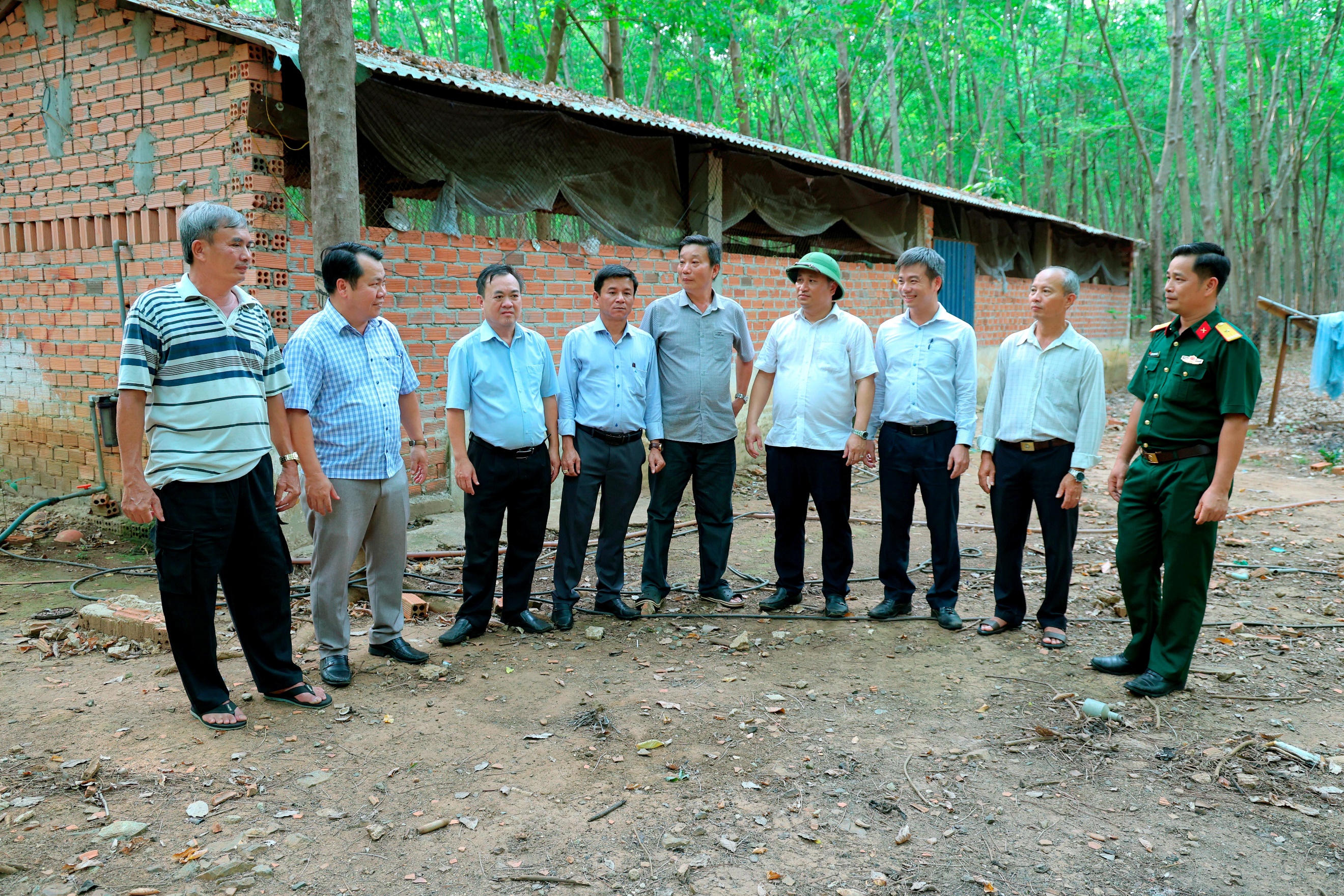 ''A group of men standing in a circle
Description automatically generated''