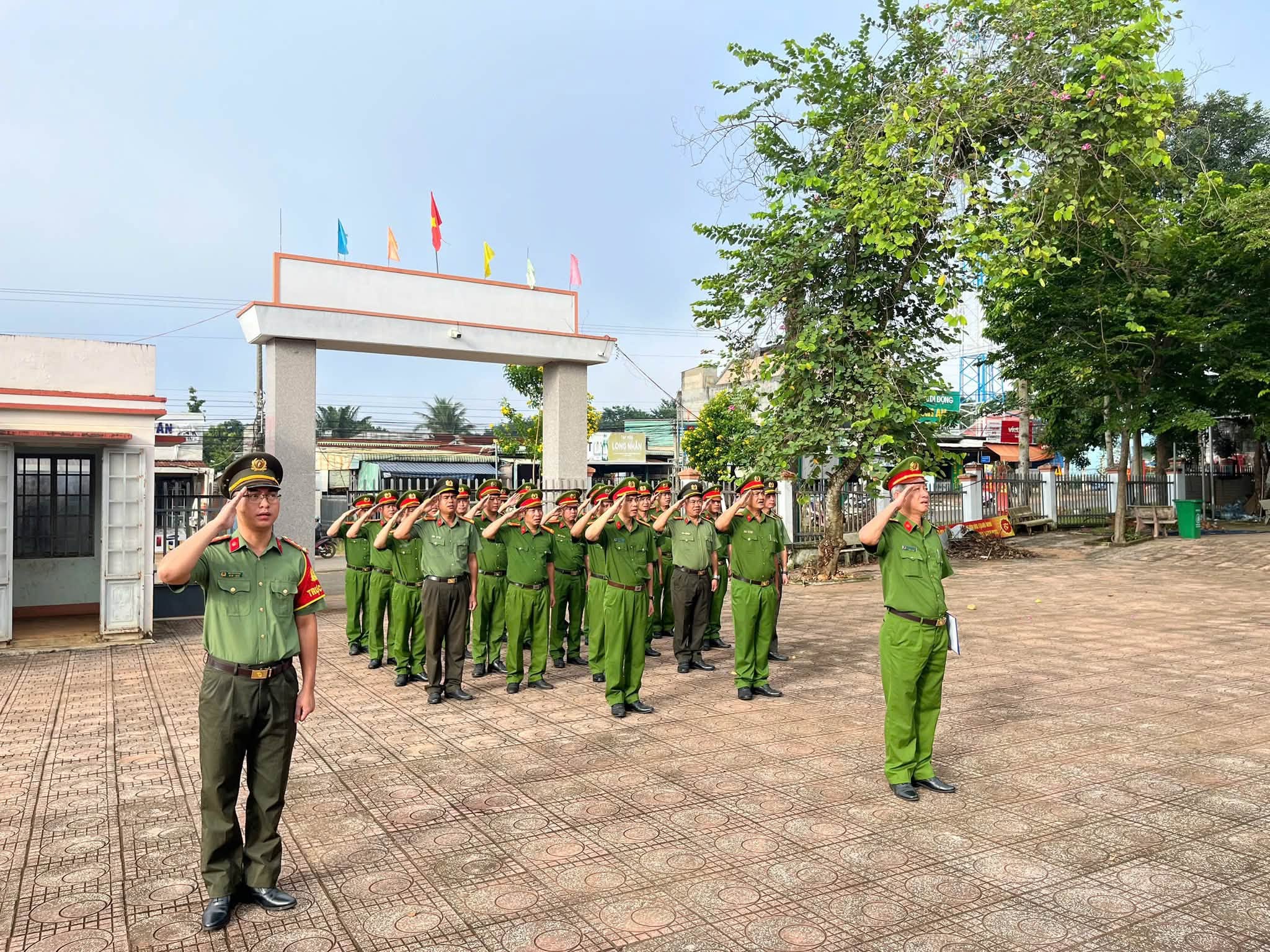 'A group of people in uniform saluting
Description automatically generated'