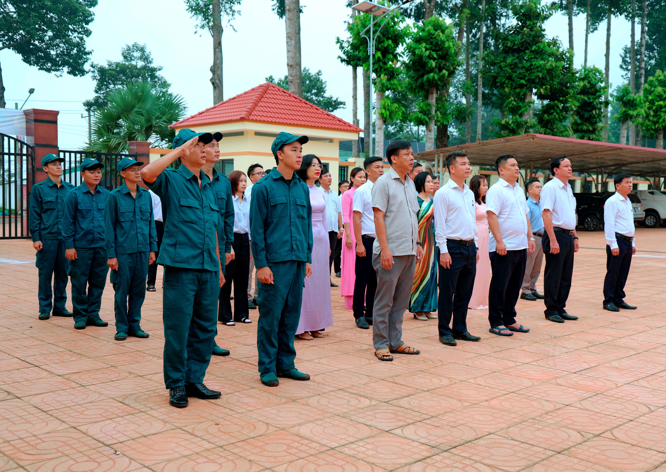 'A group of people standing in a line
Description automatically generated'