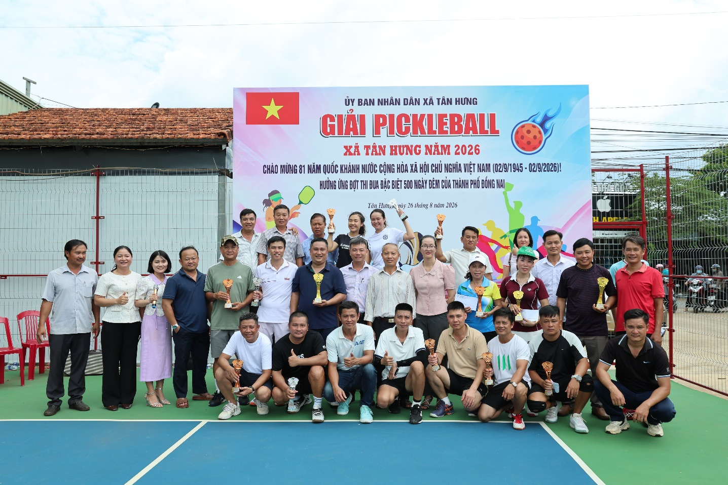 A group of people posing for a photo
Description automatically generated