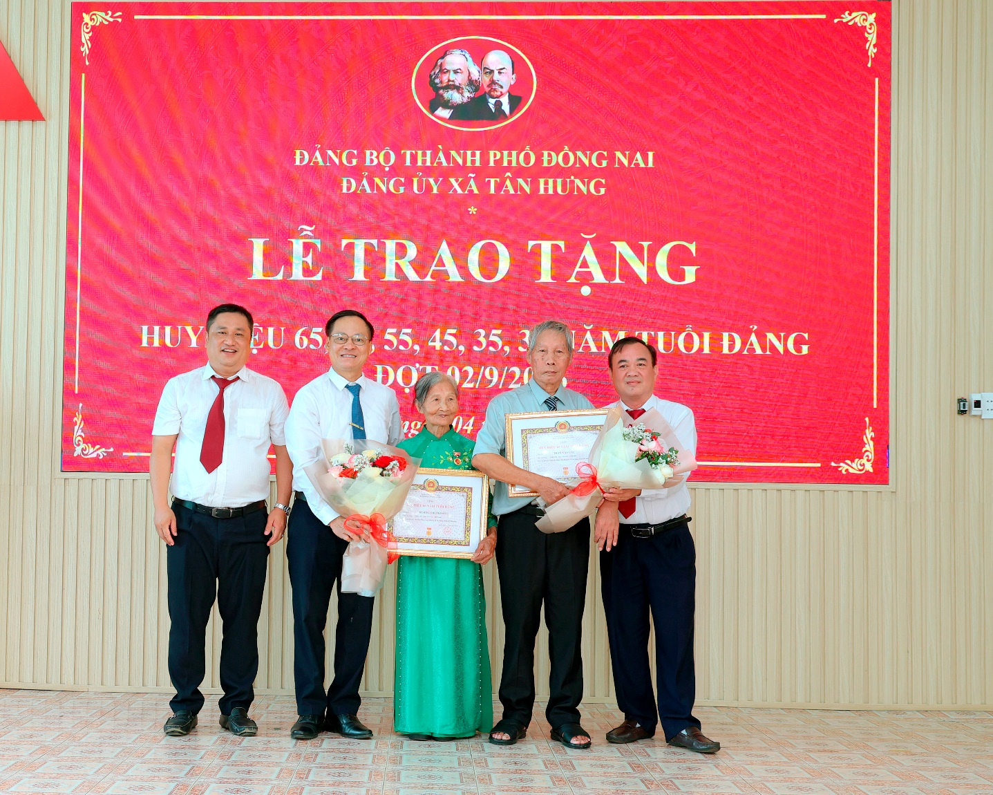A group of people posing for a photo
Description automatically generated