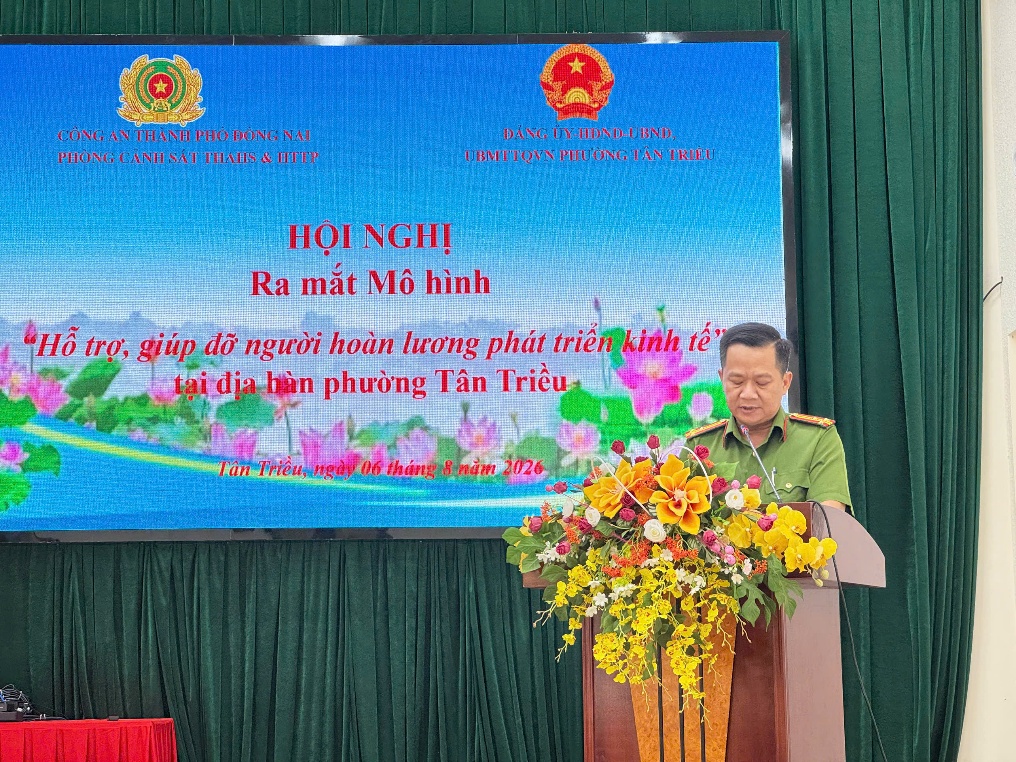 ''''''''A person standing at a podium with flowers
Description automatically generated''''''''