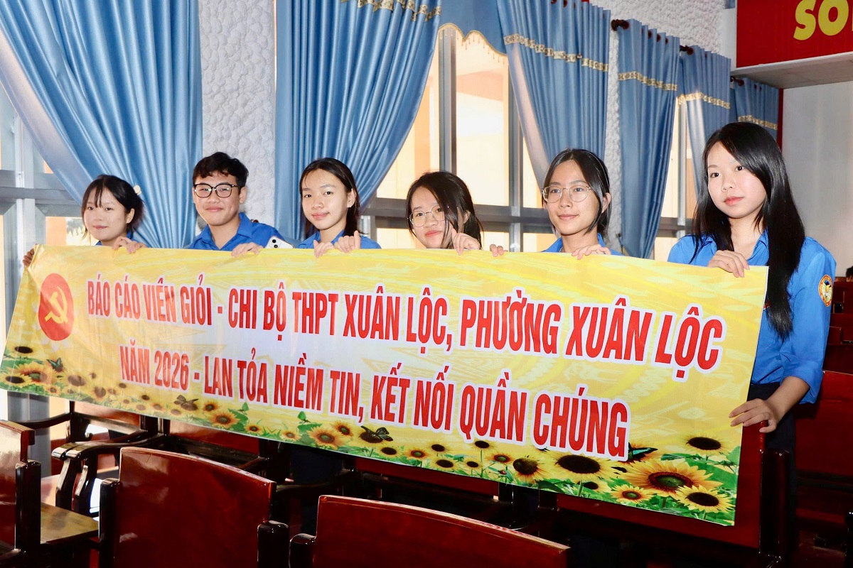 'A group of people holding a banner
AI-generated content may be incorrect.'