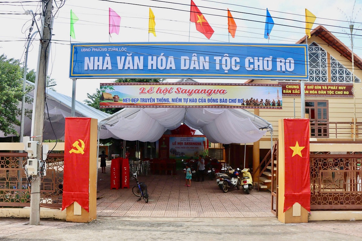 'A large white tent with flags and a sign
AI-generated content may be incorrect.'