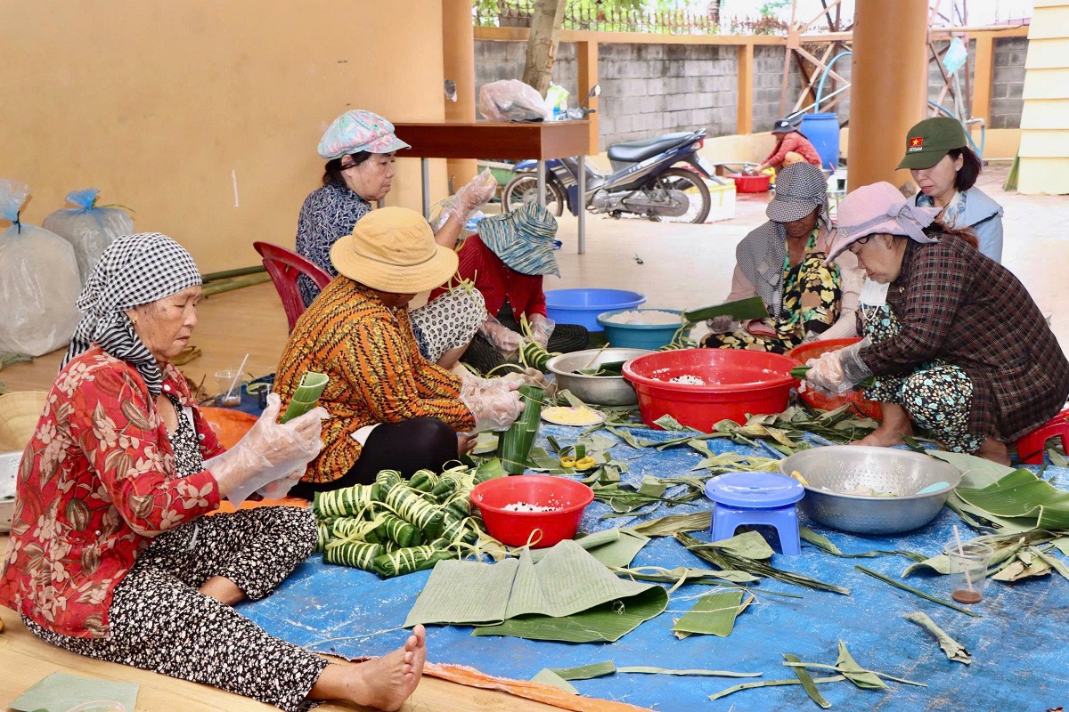 'A group of women sitting on a blue surface
AI-generated content may be incorrect.'
