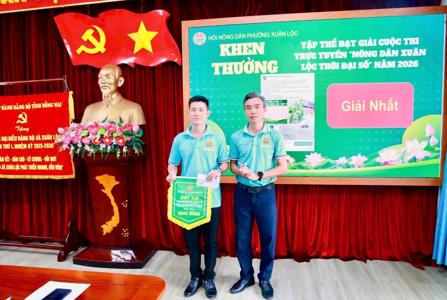 '''Two men standing in front of a banner
AI-generated content may be incorrect.'''