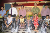 90 poor, disabled children receive scholarships and wheelchairs.