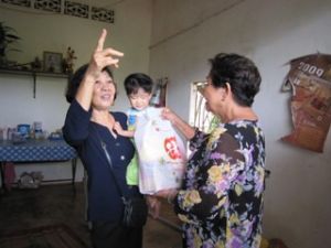 Paying Visits to and Offering Gifts to Needy Children in Vinh Cuu and Tan Phu Districts and in Bien Hoa City