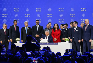 President Trump holds up his signature on the founding charter during a signing ceremony for the Board of Peace at the World Economic Forum on Thursday in Davos, Switzerland - Photo: euractiv