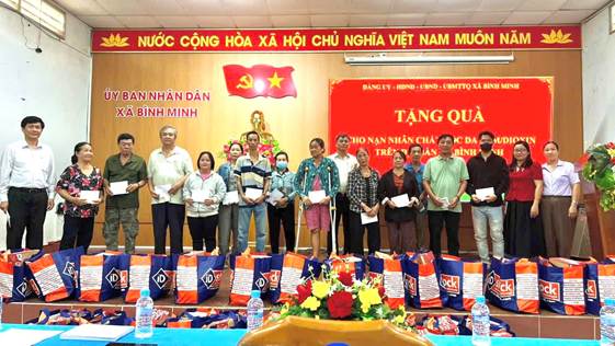 ''A group of people standing in a room

AI-generated content may be incorrect.''