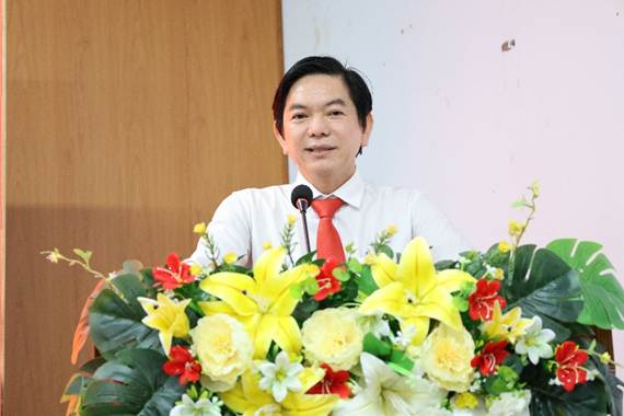 '''''A person standing behind a podium with flowersAI-generated content may be incorrect.'''''