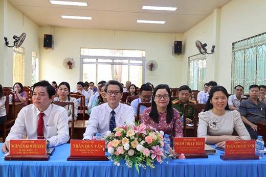 '''''A group of people sitting at a table

AI-generated content may be incorrect.'''''