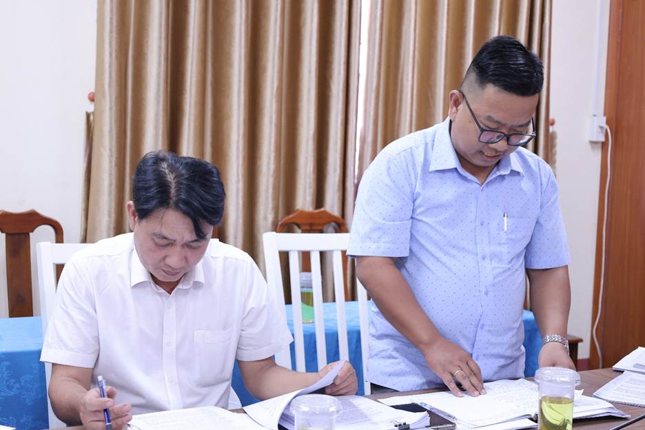 'A person and person sitting at a tableAI-generated content may be incorrect.'