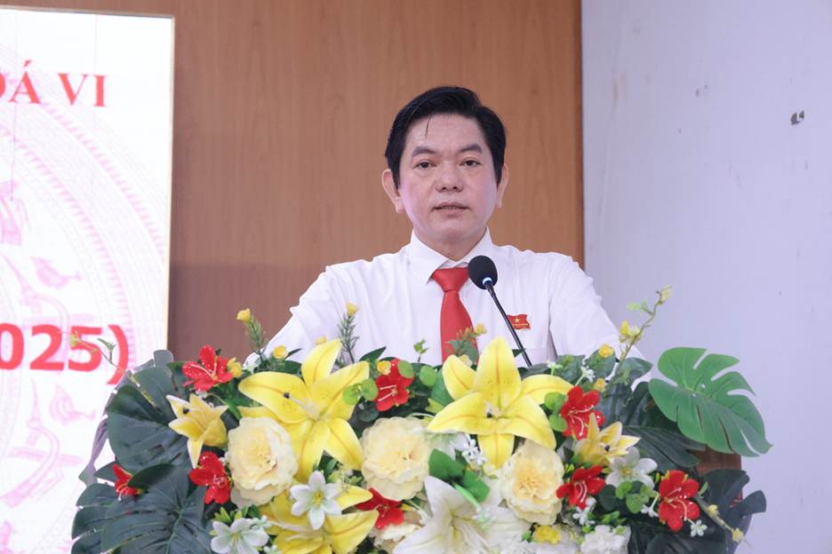 ''A person standing at a podium with flowersAI-generated content may be incorrect.''