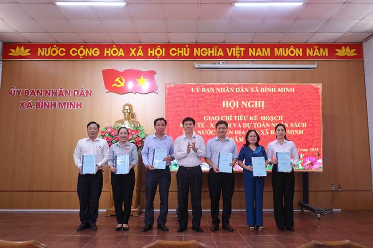 'A group of people holding papersAI-generated content may be incorrect.'