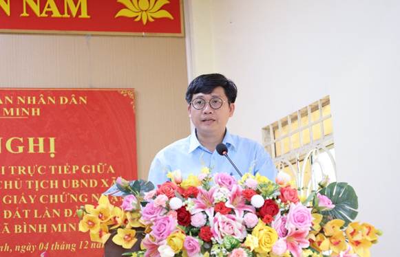 ''A person standing at a podium with flowers

AI-generated content may be incorrect.''