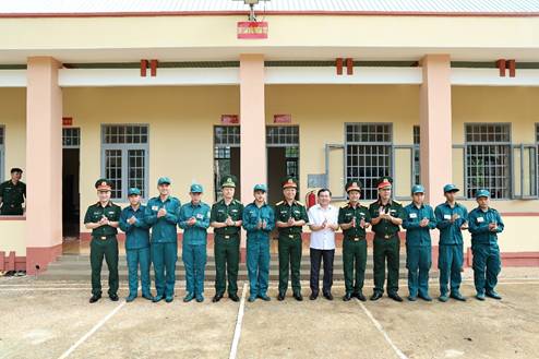 'A group of people in uniform standing in front of a building

AI-generated content may be incorrect.'