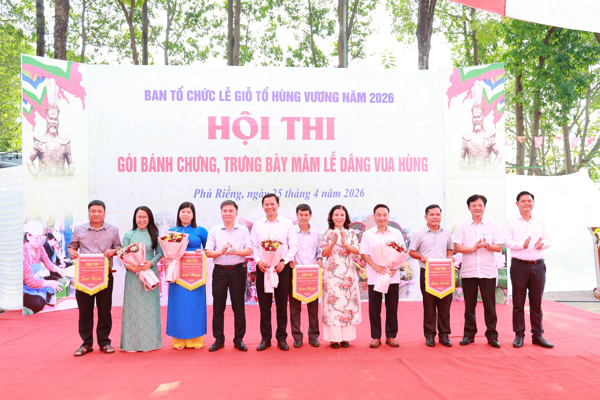 'A group of people standing in a line

Description automatically generated'