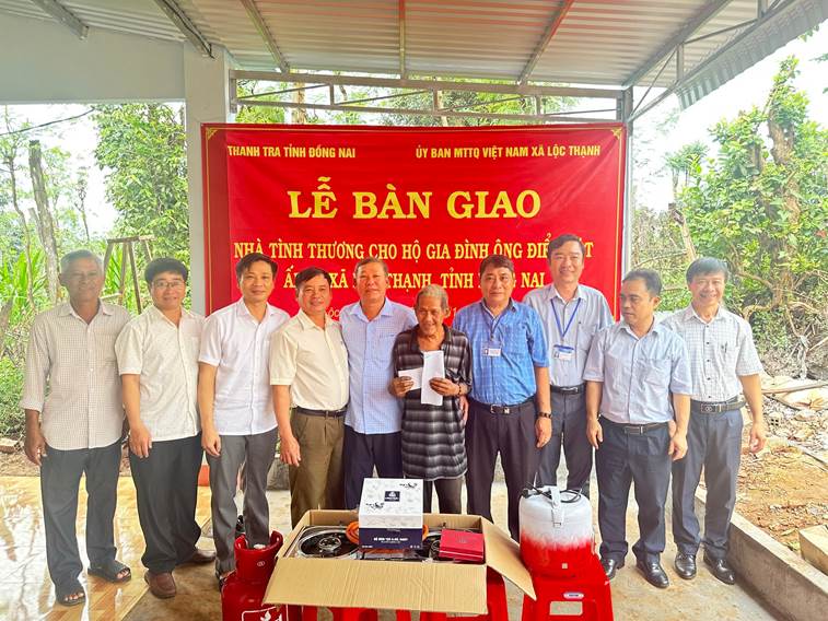 '''A group of people standing in front of a red banner

AI-generated content may be incorrect.'''