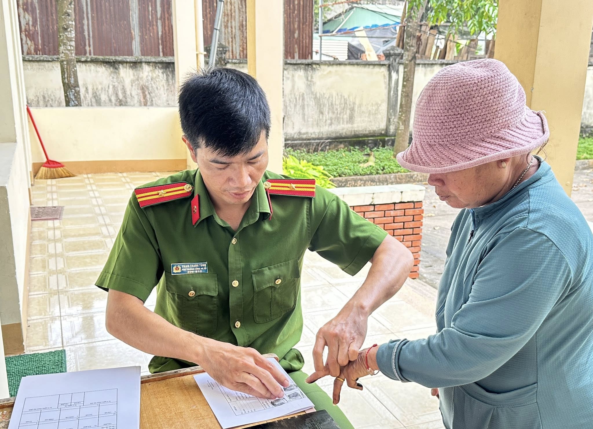 '''A person in uniform pointing at a piece of paper

AI-generated content may be incorrect.'''
