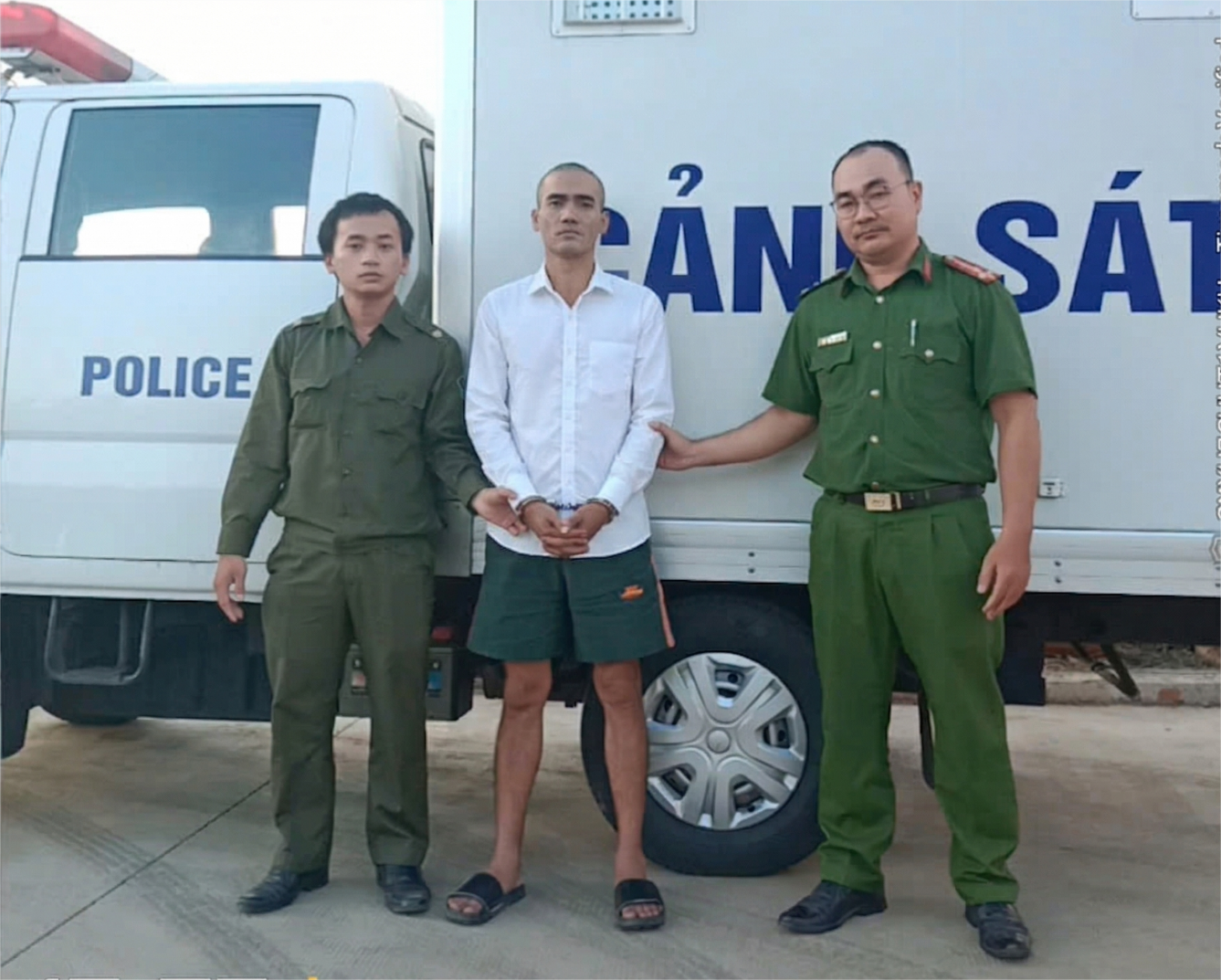 ''''''Description: A group of men in uniform standing in front of a white van

AI-generated content may be incorrect.''''''